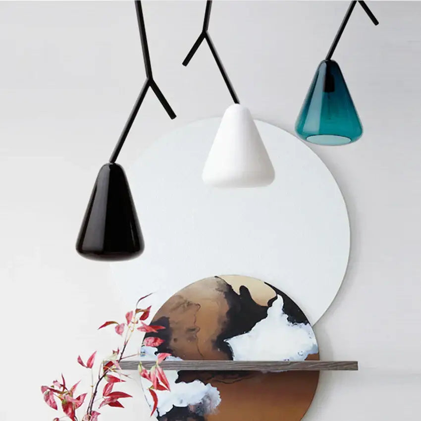 Modern black branching glass pendant lights with sleek metal arms and conical matte black, glossy white, and teal shades