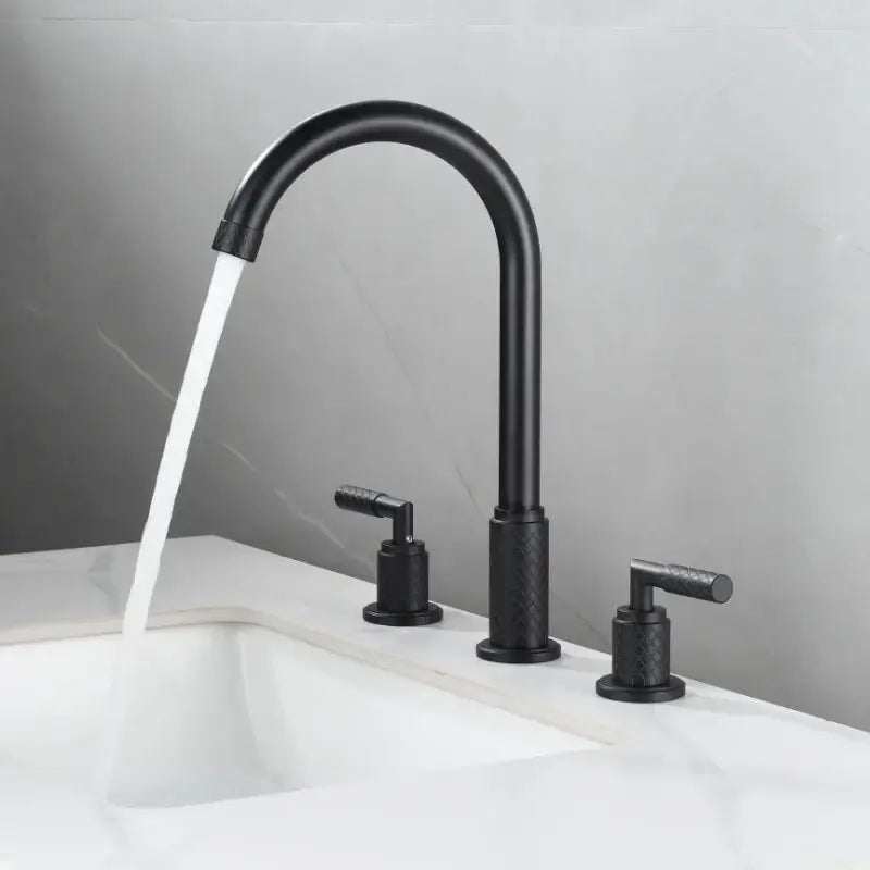 Modern black brass basin faucet with textured handles and curved spout water flowing for bathroom decorbites black brass