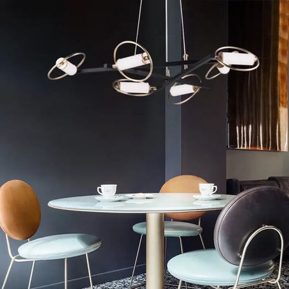 Modern black and brass pendant light with circular rings and white cylinder fixtures for dining room decorbites circular ring led