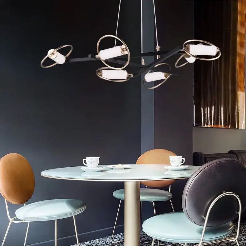 Modern black and brass pendant light with circular rings and white cylinder fixtures for dining room decorbites circular ring led