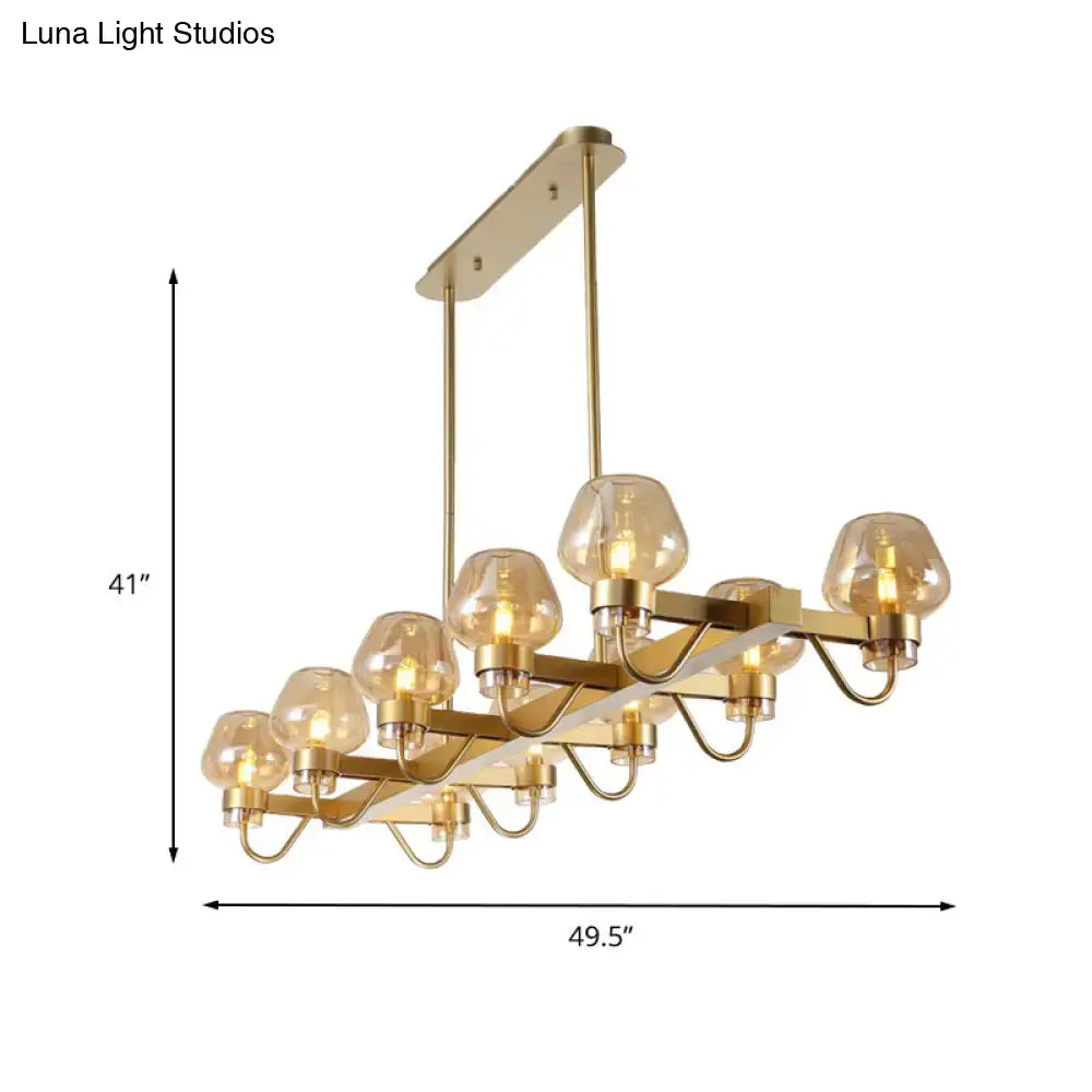 Gold-toned DecorBites™ contemporary island lamp with 10 clear amber smoke glass bulbs and black brass frame 110v-120v