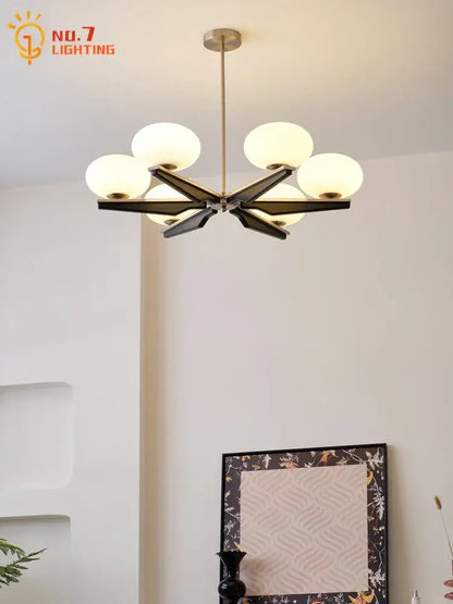 Modern black and brass wood led chandelier with six frosted glass globes for decorbites cream wood living room lighting