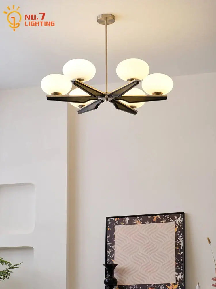 Modern black and brass wood led chandelier with six frosted glass globes for decorbites cream wood living room lighting