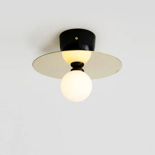 Modern black and brass wall light fixture with frosted glass ball bulb ideal for bedroom decorbites golden glass