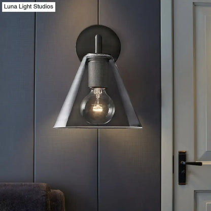 Modern black and brass glass cone wall light with matte black backplate and direct wired electric design for bedrooms