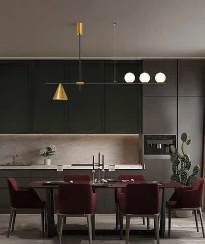 Modern black and brass linear chandelier with gold metal frame and spherical white glass bulbs for dining room lighting