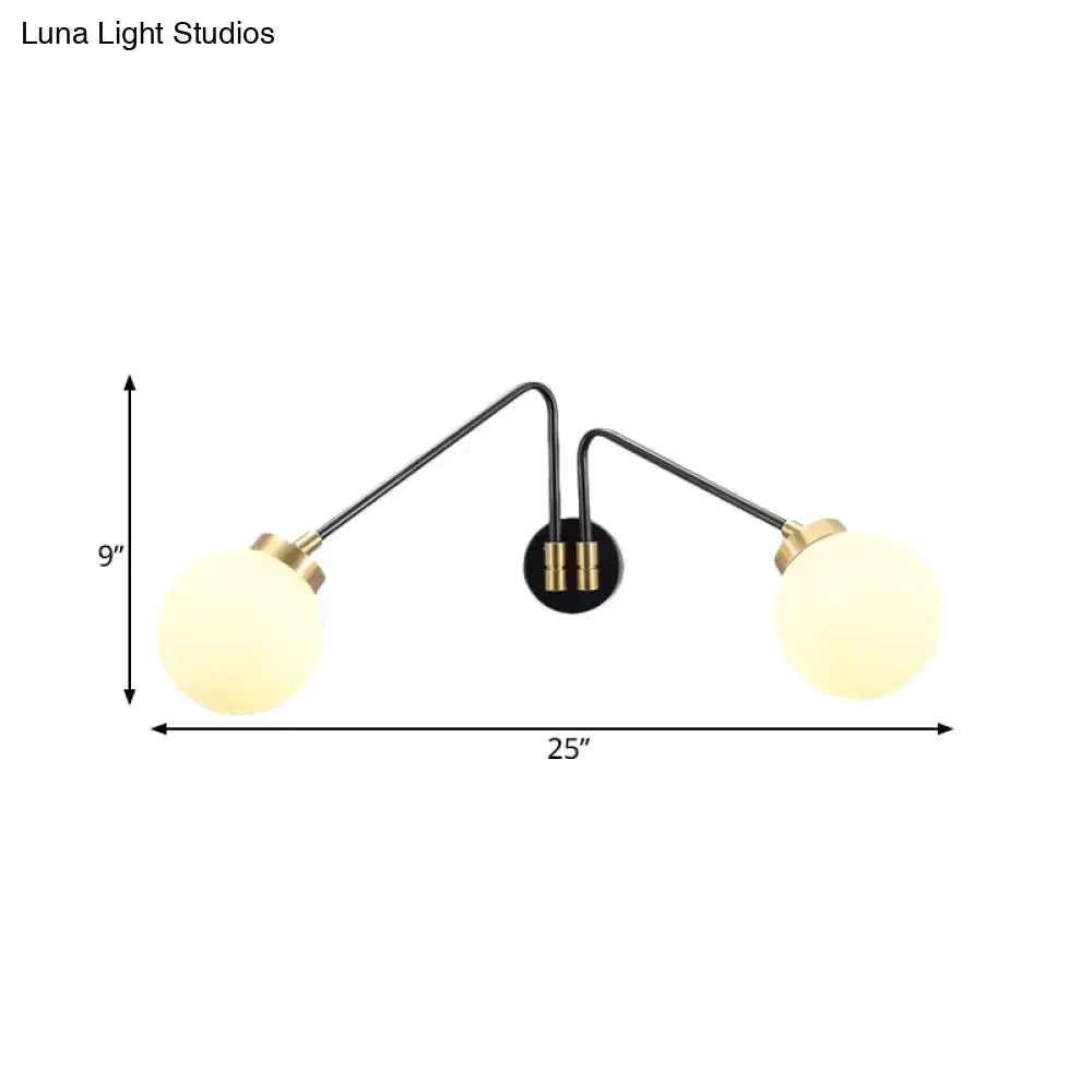 Modern black and brass wall lamp with milk glass frosted globe shades for bedroom sconce lighting