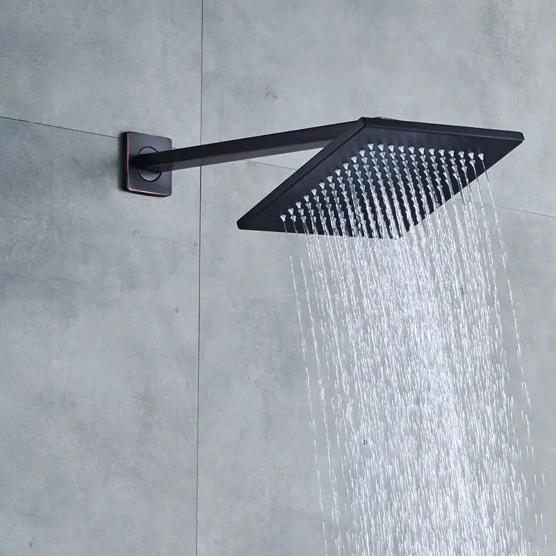 Modern black brass shower faucet with rainfall head featuring a black matte square shower faucet by decorbites black brass