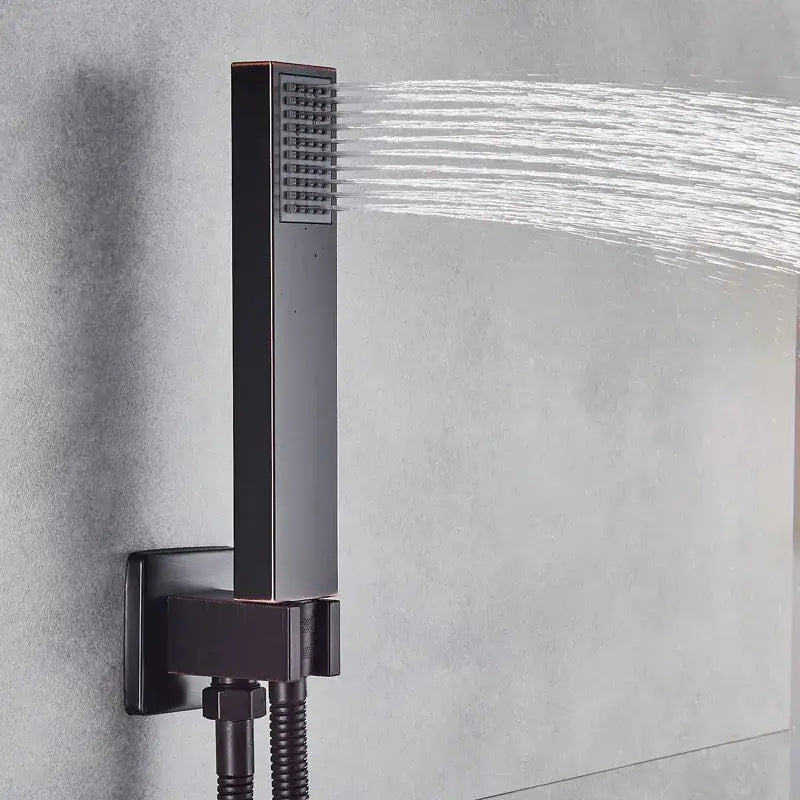 Modern black brass shower faucet with matte black rectangular rainfall showerhead featuring multiple jets for bathroom use