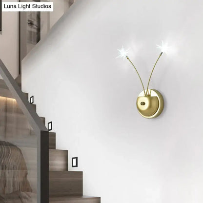 Modern black cast iron double globe wall sconce with gold-toned arms and star-shaped lights 15 inches fixture