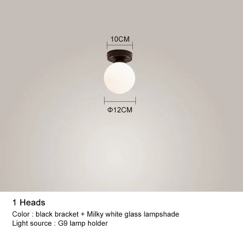Modern black chandelier with gold frosted glass globe and black bracket featuring milky white glass lampshade decorbites black chandelier