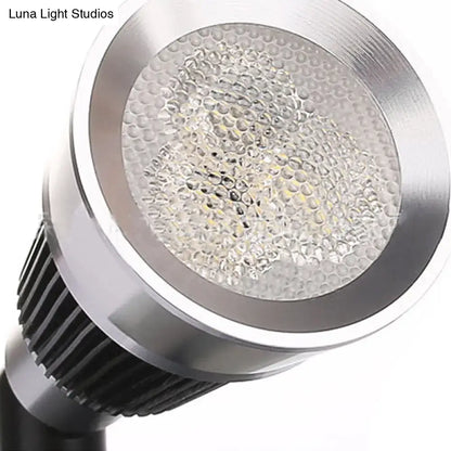 Modern black and chrome smd wall light with silver led spotlight, honeycomb diffuser, and black heat sink fins