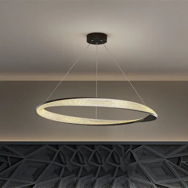 Modern black circle chrome chandelier pendant light with sleek black and gold frame and warm led woven texture glow