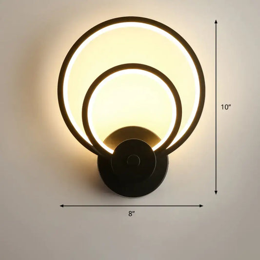 Modern black circular led light fixture wall sconce with two concentric illuminated rings and remote control feature