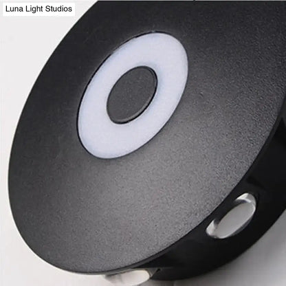 Modern black circular led outdoor wall sconce with matte finish and concentric white ring design for outdoor wall lighting