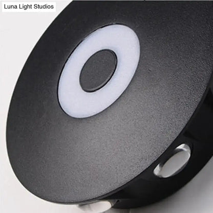 Modern black circular led outdoor wall sconce with matte finish white ring and black button for outdoor wall lighting