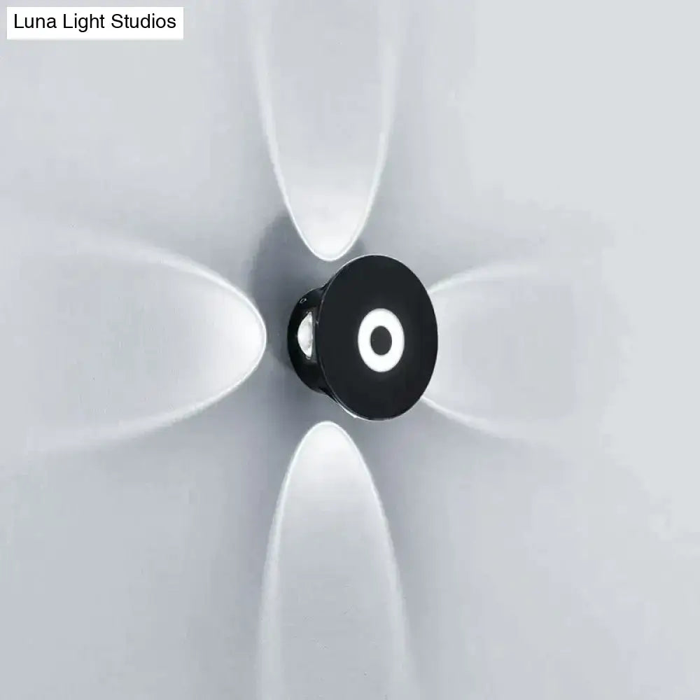 Modern black circular led outdoor wall sconce with glowing white ring designed for outdoor wall garden lighting