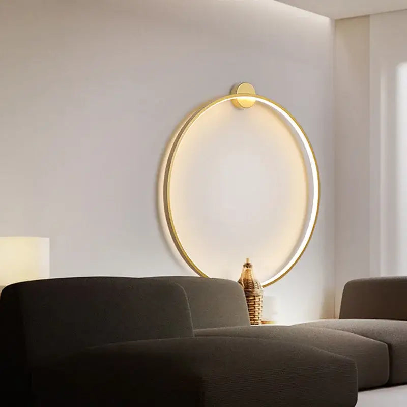 Gold circular wall sconce with glowing ring and minimalist design for modern black led wall lights bedroom decorbites wall lights