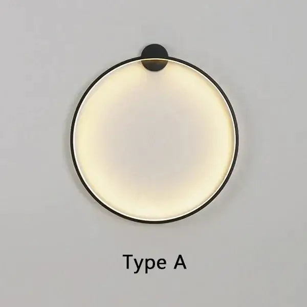 Minimalist modern black circular wall lamp with sleek frame and warm diffused LED lighting for living room decorbites circular wall