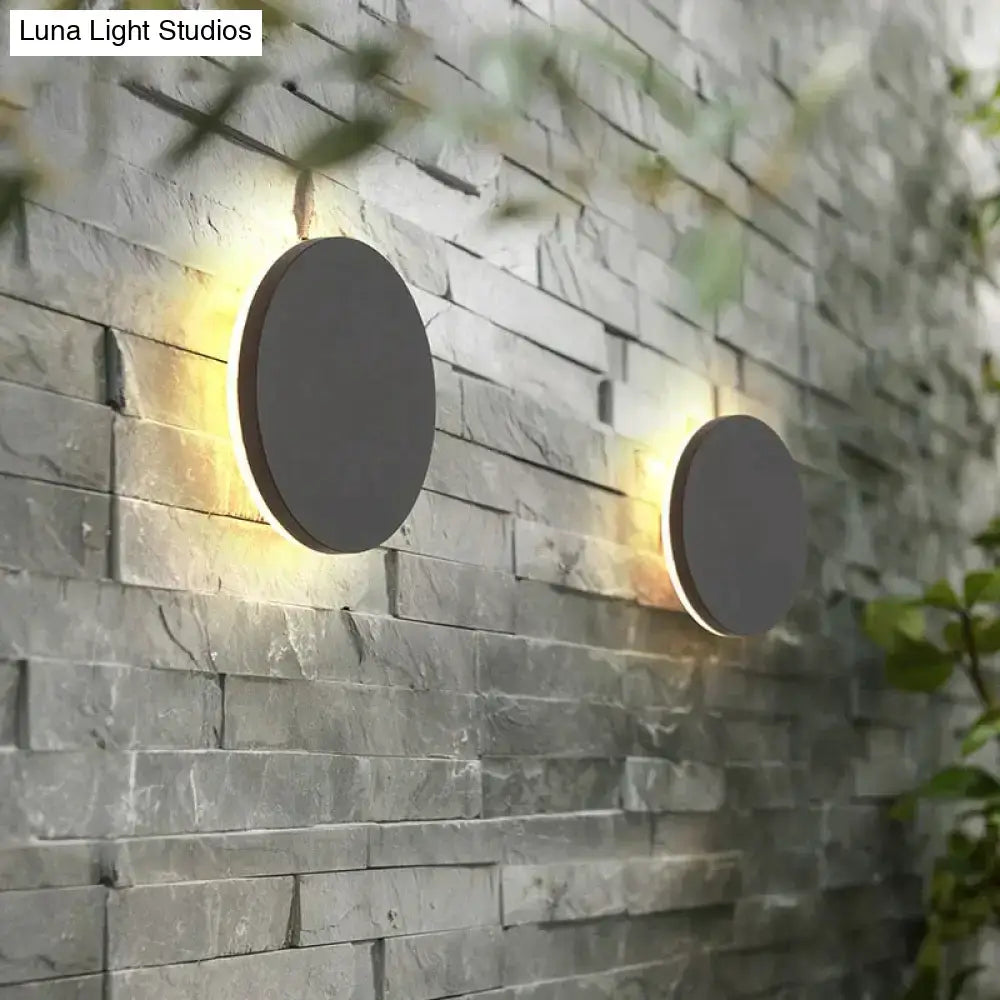 Modern black circular waterproof wall lamp set featuring sleek matte gray finish and warm ambient lighting for bedroom use