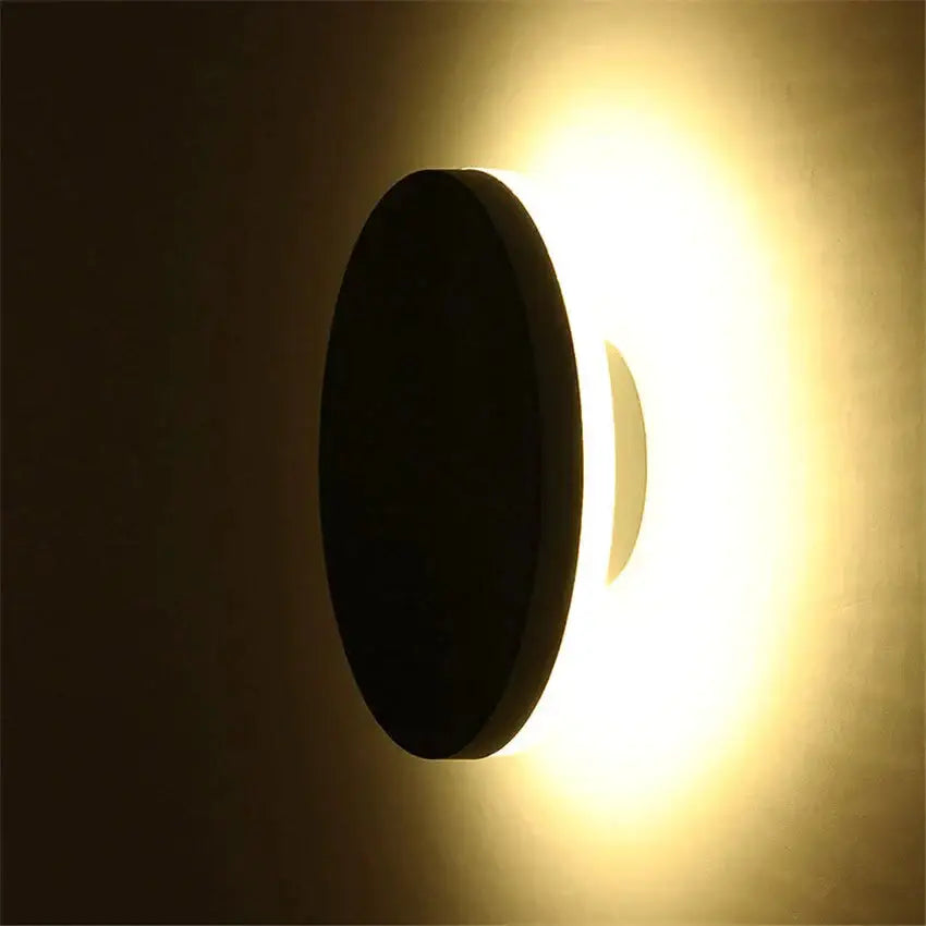 Modern black circular waterproof wall lamp with warm glowing light ideal for bedroom three disc set installation
