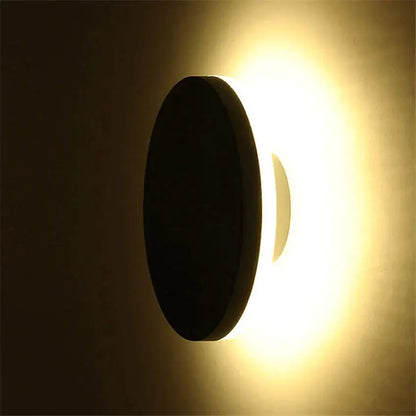 Modern black circular waterproof wall lamp with warm glowing light ideal for bedroom three disc set installation