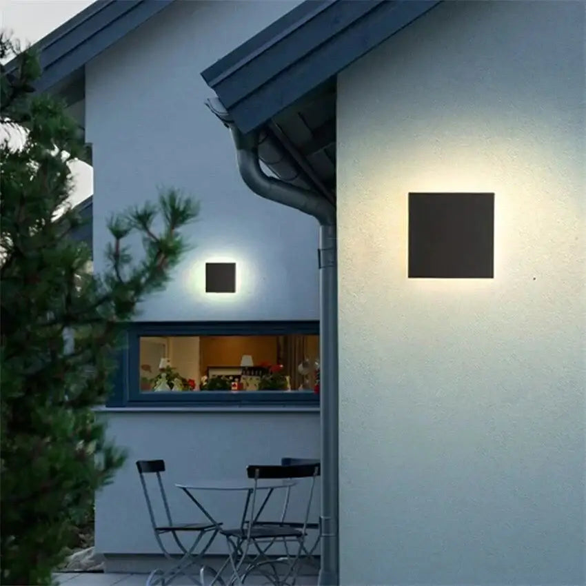 Modern black circular waterproof wall lamp three disc set with sleek finish and warm ambient lighting for bedroom use