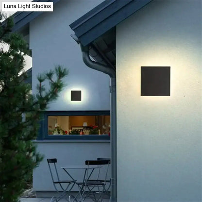 Modern black wall lamp with square design and warm diffused lighting ideal for bedroom use in three disc set