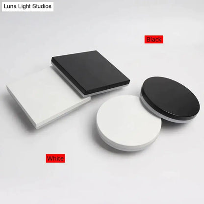 Black and white square and circular glossy display stands showcasing modern black circular waterproof wall lamp three disc set