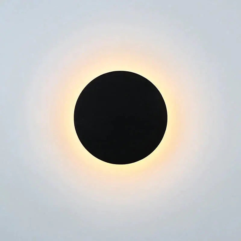 Modern black circular waterproof wall lamp with warm glowing halo effect ideal for bedroom lighting set of three discs