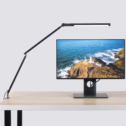 Modern black clip led desk lamp with articulated arm and sleek design ideal for office reading and task lighting