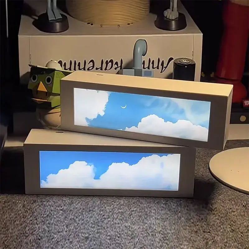 Beige rectangular cardboard cloud night light with glowing blue sky design for modern bedroom decorbites cloud night light