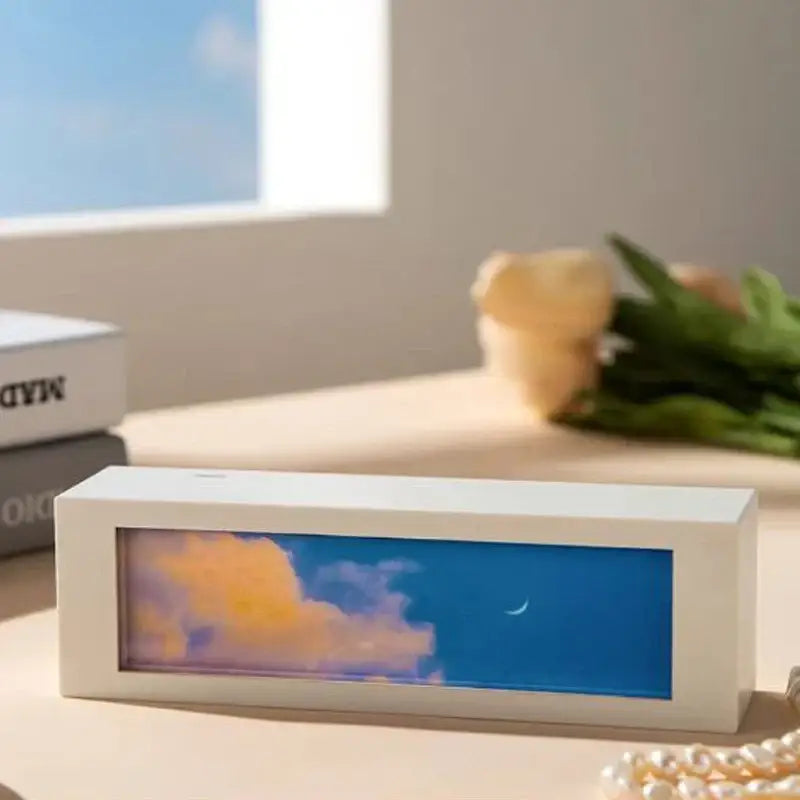 White rectangular desk lamp with glowing blue sky and orange cloud scene in front panel modern cloud night light decorbites