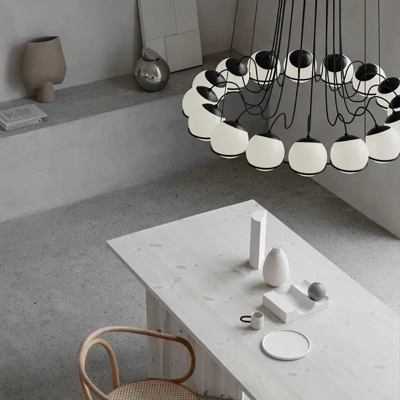 Modern black and white spherical pendant lights with glass shade led design and sculptural concentric chandelier style