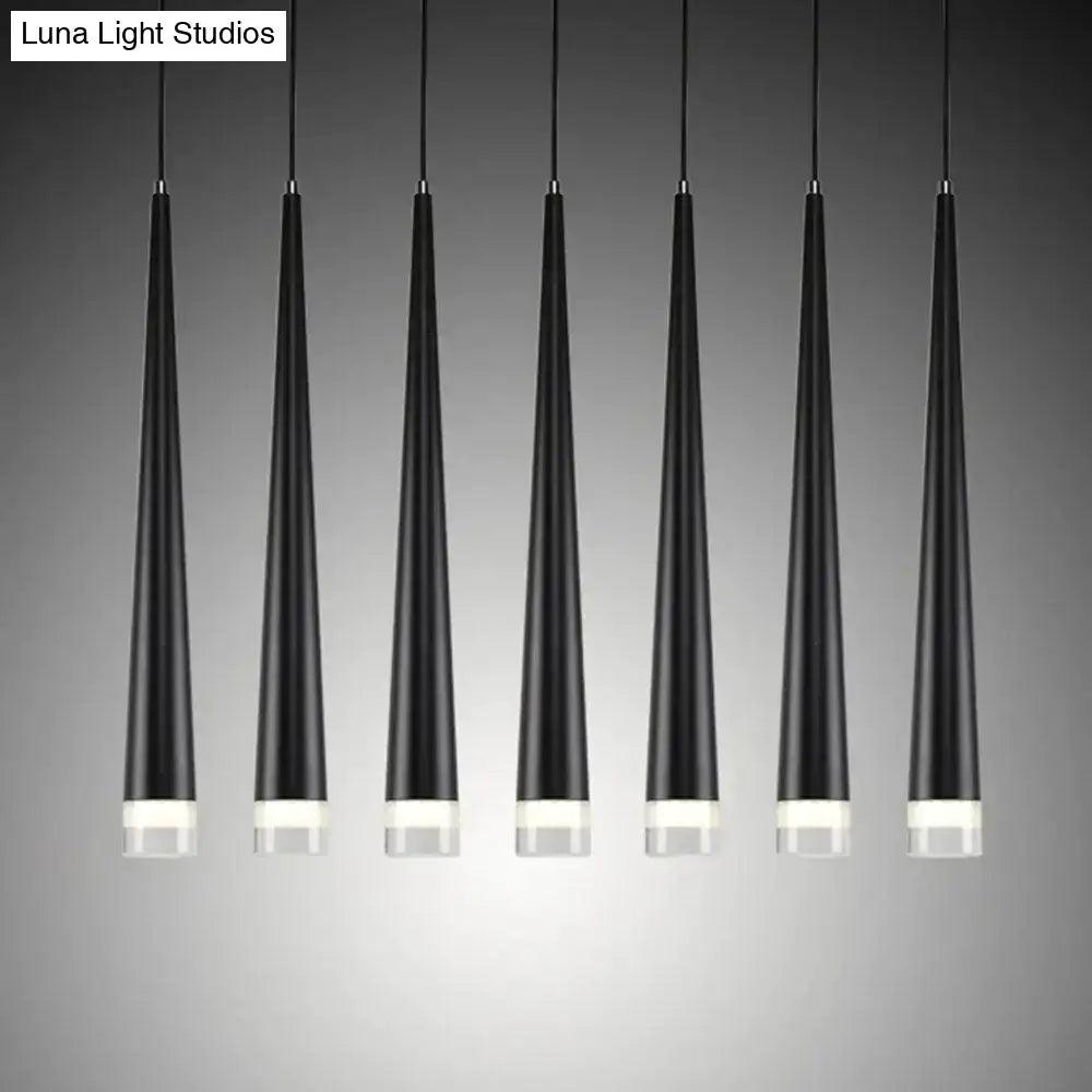 Six sleek black conical led pendant lamps with frosted glass bases hang in a modern kitchen island arrangement