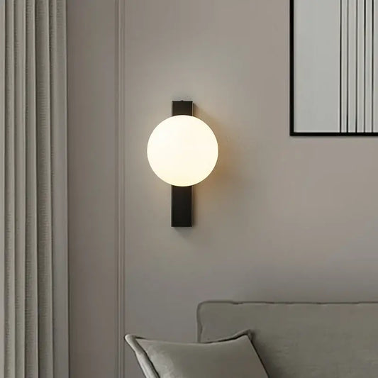 Modern black copper wall sconce with frosted glass globe for bedroom lighting by decorbites black copper estiluz