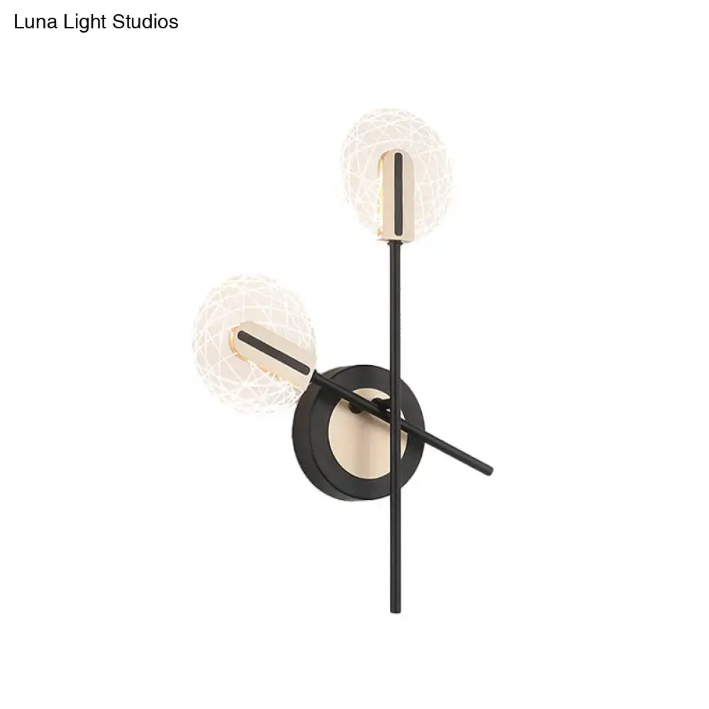 Modern black and gold two-light wall light with textured glass globes emitting warm white 220v-240v illumination