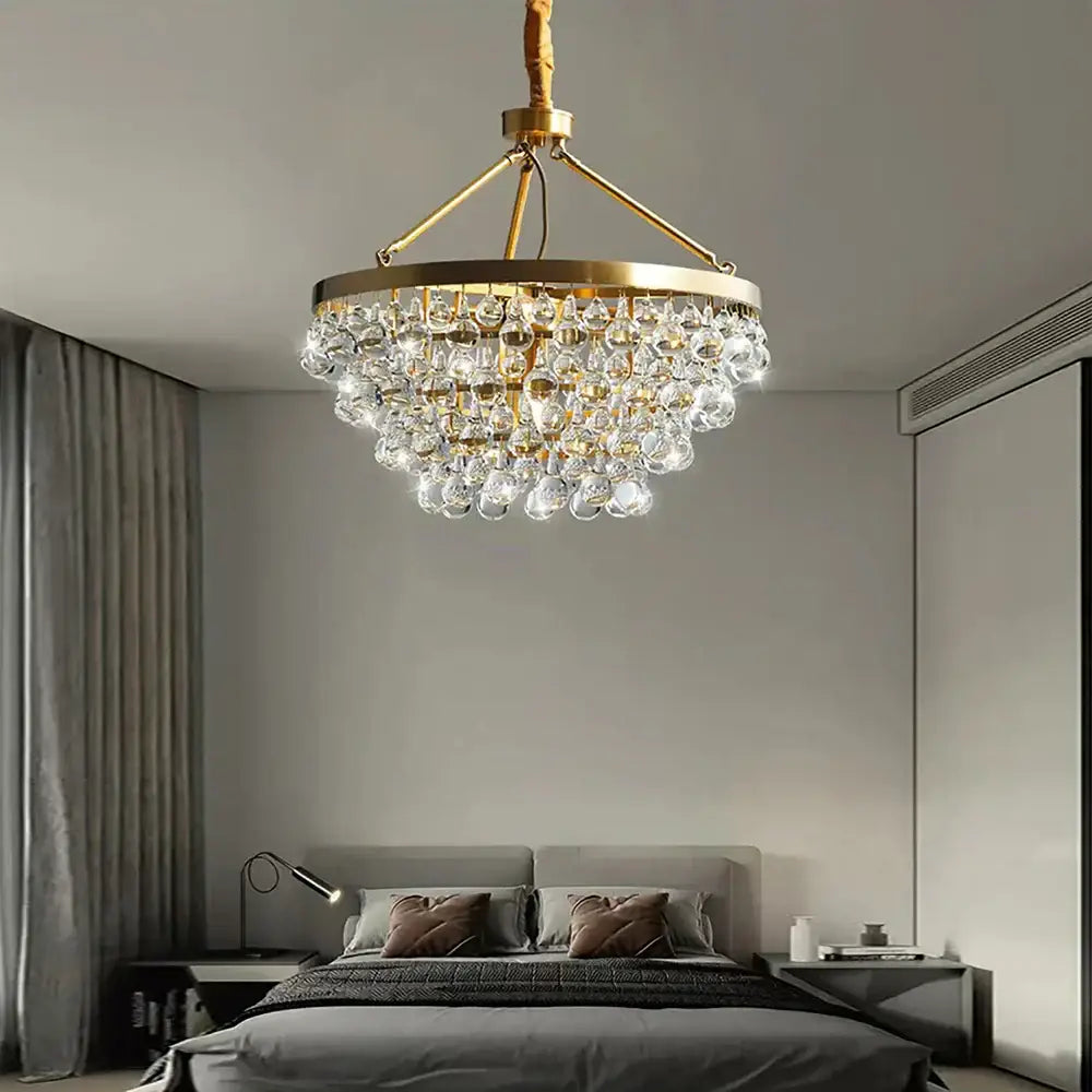 A modern black crystal bead chandelier with tiered gold-toned crystal bead ceiling decorbites light for dining room