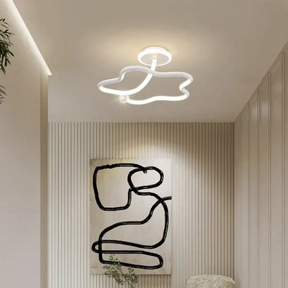 Modern white led ceiling light with sleek cloud-like design complementing decorbites black crystal chandelier