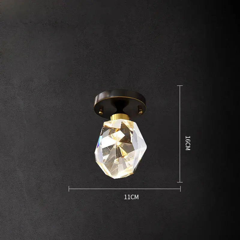Modern black crystal copper chandelier featuring a faceted crystal pendant light with a brass-finished base for dining room decorbites black crystal