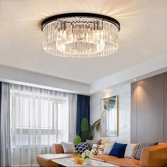 Modern black crystal flush mount ceiling light with a circular metal frame and cascading clear glass prisms for dining rooms
