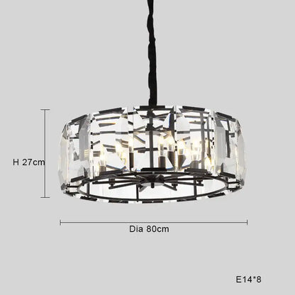 A modern black crystal pendant chandelier with clear faceted glass panels and a black metal frame for luxe dining room decor