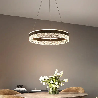 Modern black crystal ring led pendant light with a circular frame and sparkling crystal accents for bedroom decorbites lighting