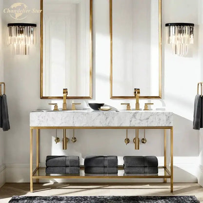Modern black crystal wall lamp with clear and smoked glass above gold-framed double vanity and marble countertop decorbites crystal wall lamp