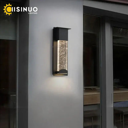 Modern black crystal wall light with pir motion sensor featuring a sparkling illuminated glass panel for outdoor use