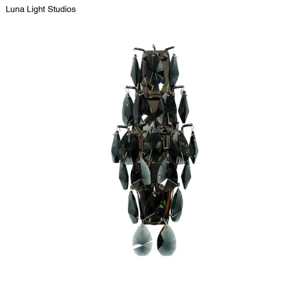 Elegant modern black crystal wall sconce with tiered faceted teardrop crystals for living room lighting fixture