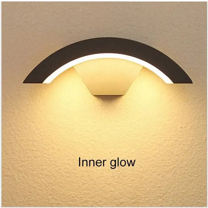 Modern black curved led waterproof outdoor wall lamp with warm inner glow and motion sensor by decorbites led waterproof