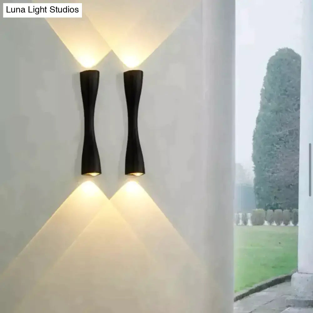 Modern black curved wall sconce outdoor waterproof porch light with sleek design and warm focused lighting