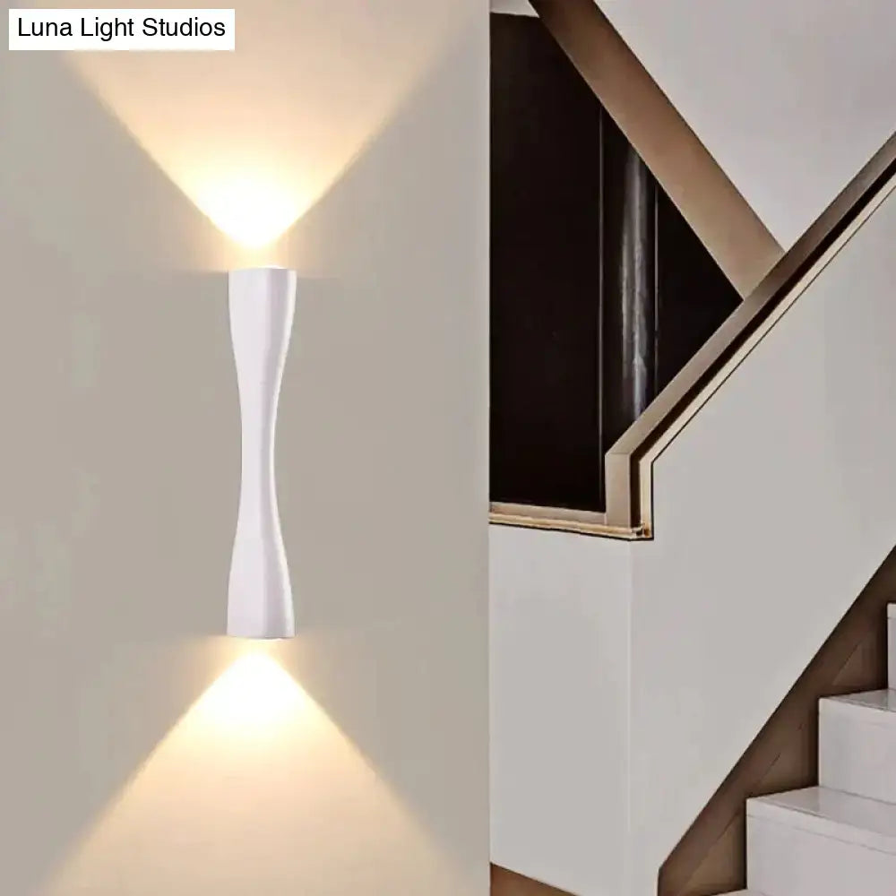 Modern white curved wall sconce with sleek design casting warm light for outdoor porch waterproof lighting