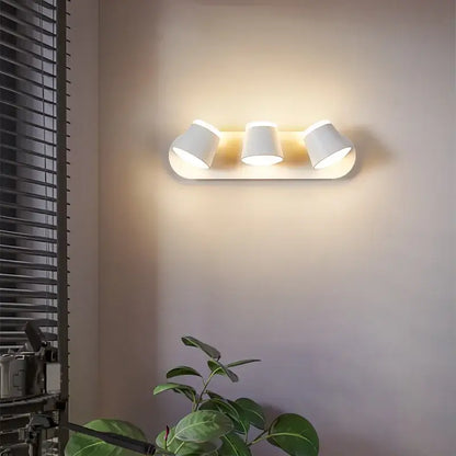 White three-light wall lamp with cylindrical shades and sleek modern design for decorbites adjustable led wall use